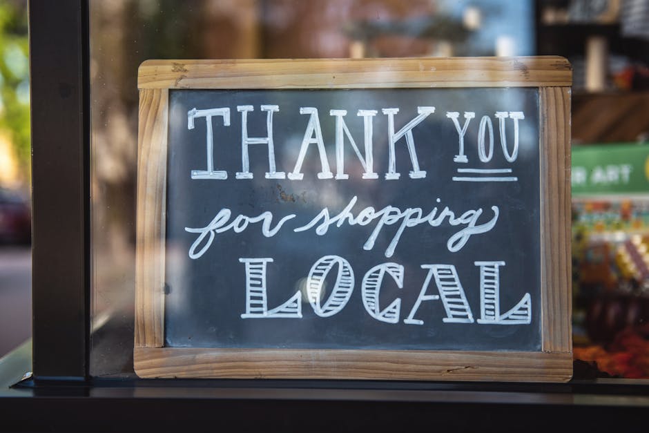 Chalkboard sign encourages shopping local in San Luis Obispo store.